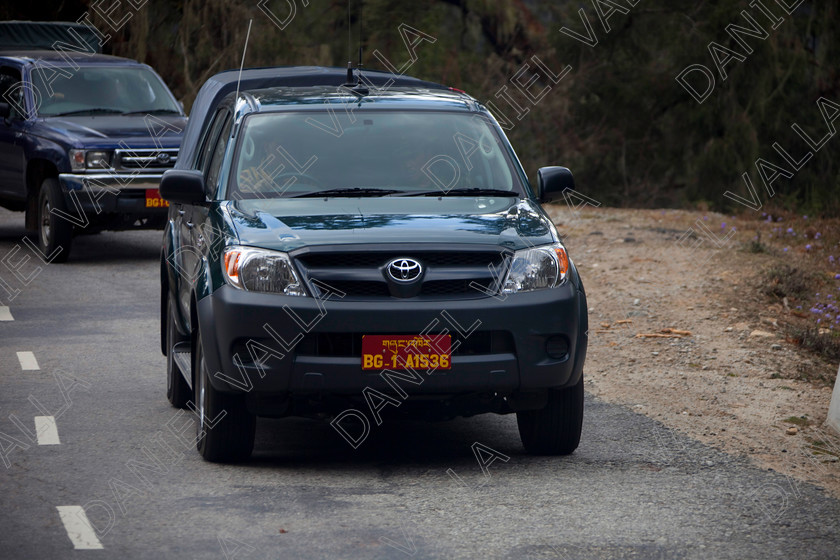 91466 Bhutan-King 
 bodyguards of King of Bhutan in his Toyota motorcar 
 Keywords: King of Bhutan bhutanese royal car driving private number plate, Bhutan