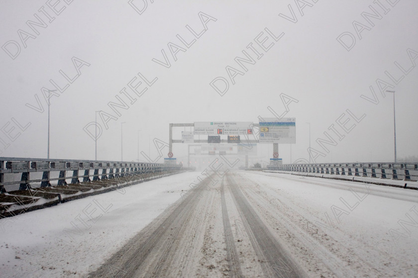 90290 RoadSnow 
 Snow over Motorway approach to Channel Tunnel Calais 
 Keywords: road snow channel tunnel motorway travel winter