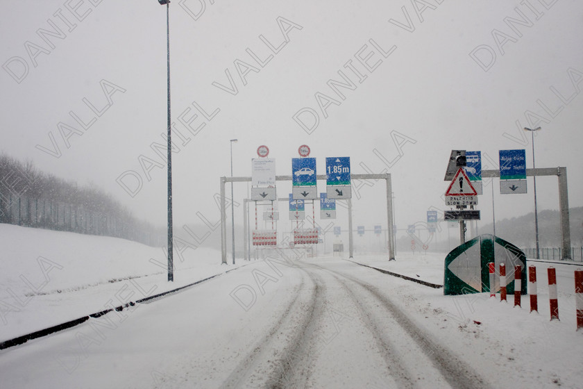 90307 RoadSnow 
 Snow over Motorway approach to Channel Tunnel Calais 
 Keywords: road snow channel tunnel motorway travel winter