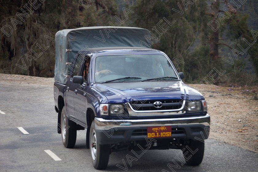 91472 Bhutan-King 
 bodyguards of King of Bhutan in his Toyota motorcar 
 Keywords: King of Bhutan bhutanese royal car driving private number plate, Bhutan