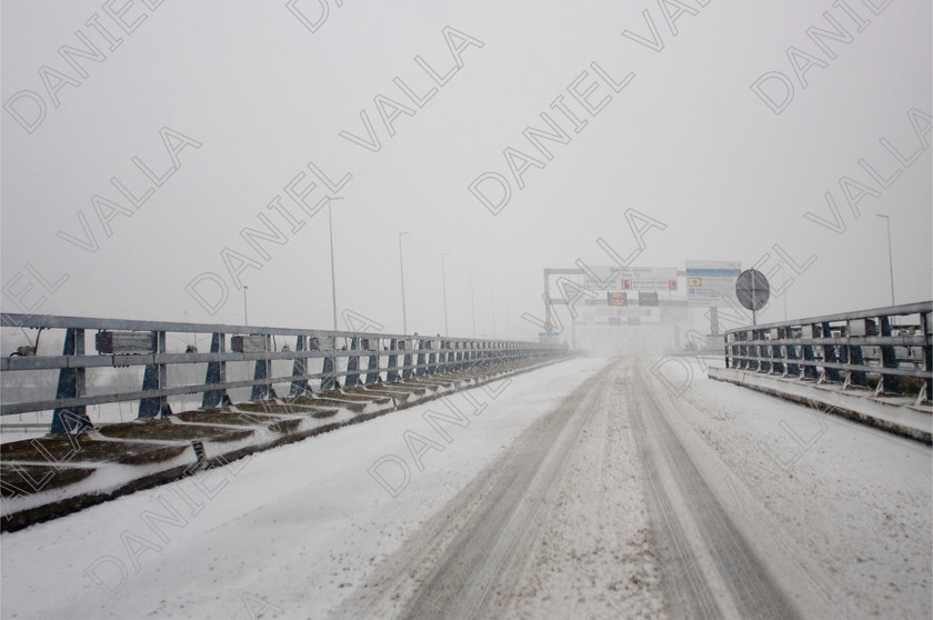 90289 RoadSnow 
 Snow over Motorway approach to Channel Tunnel Calais 
 Keywords: road snow channel tunnel motorway travel winter